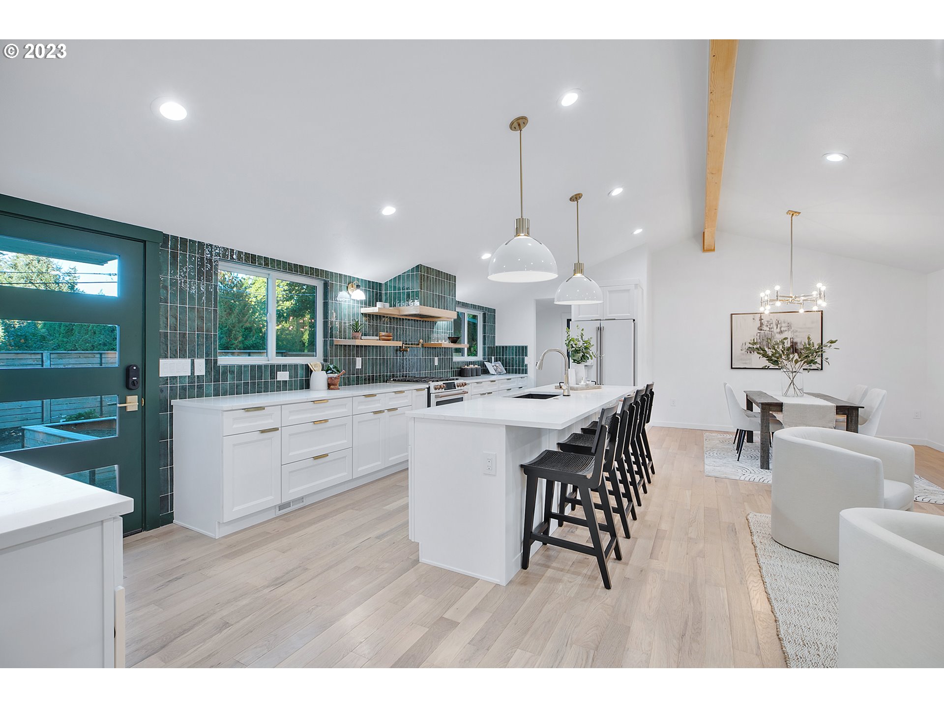 9906 Northwest Leahy Road Portland, OR 97229 - Photo 13 of 36 a large kitchen with a table and chairs