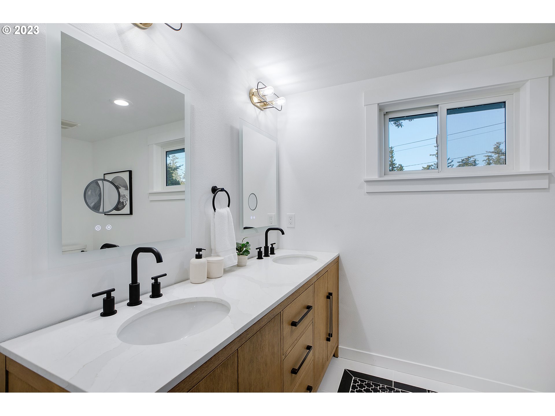 9906 Northwest Leahy Road Portland, OR 97229 - Photo 22 of 36 a bathroom with a sink and a mirror