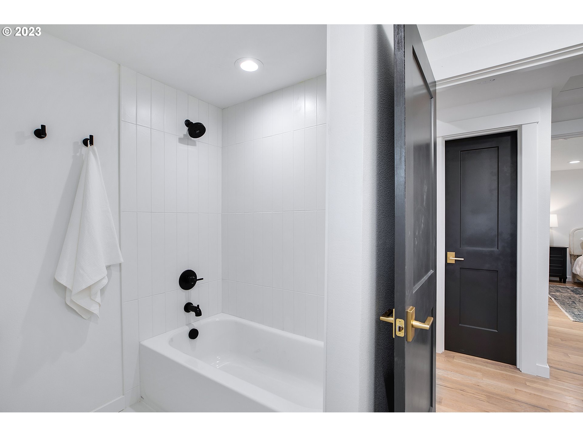 9906 Northwest Leahy Road Portland, OR 97229 - Photo 23 of 36 a bathroom with a bathtub and a shower