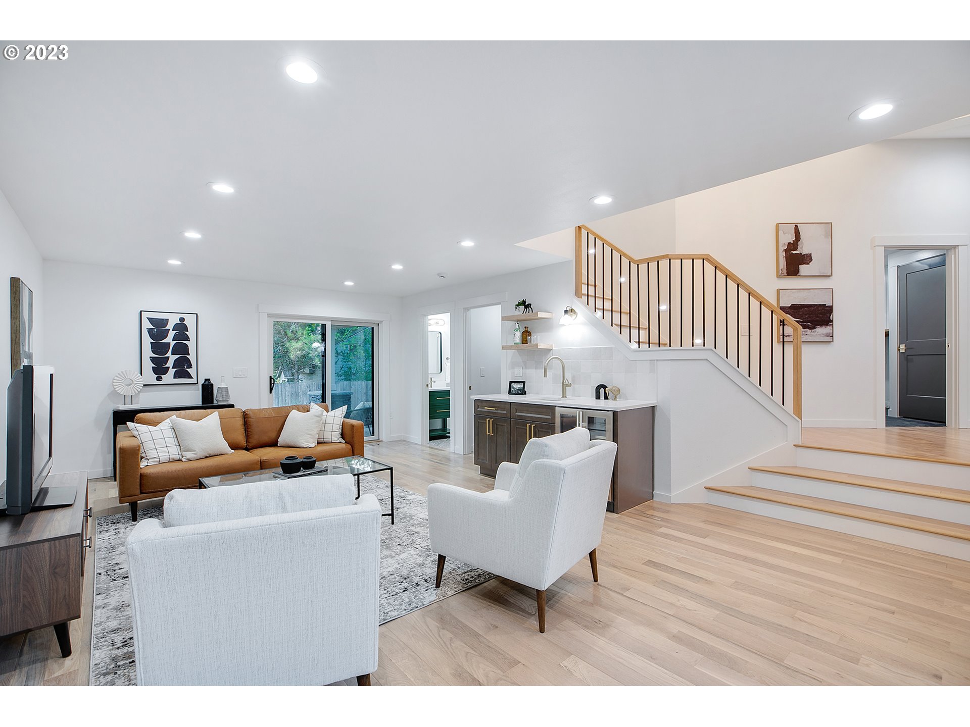 9906 Northwest Leahy Road Portland, OR 97229 - Photo 27 of 36 a living room with furniture and a wooden floor