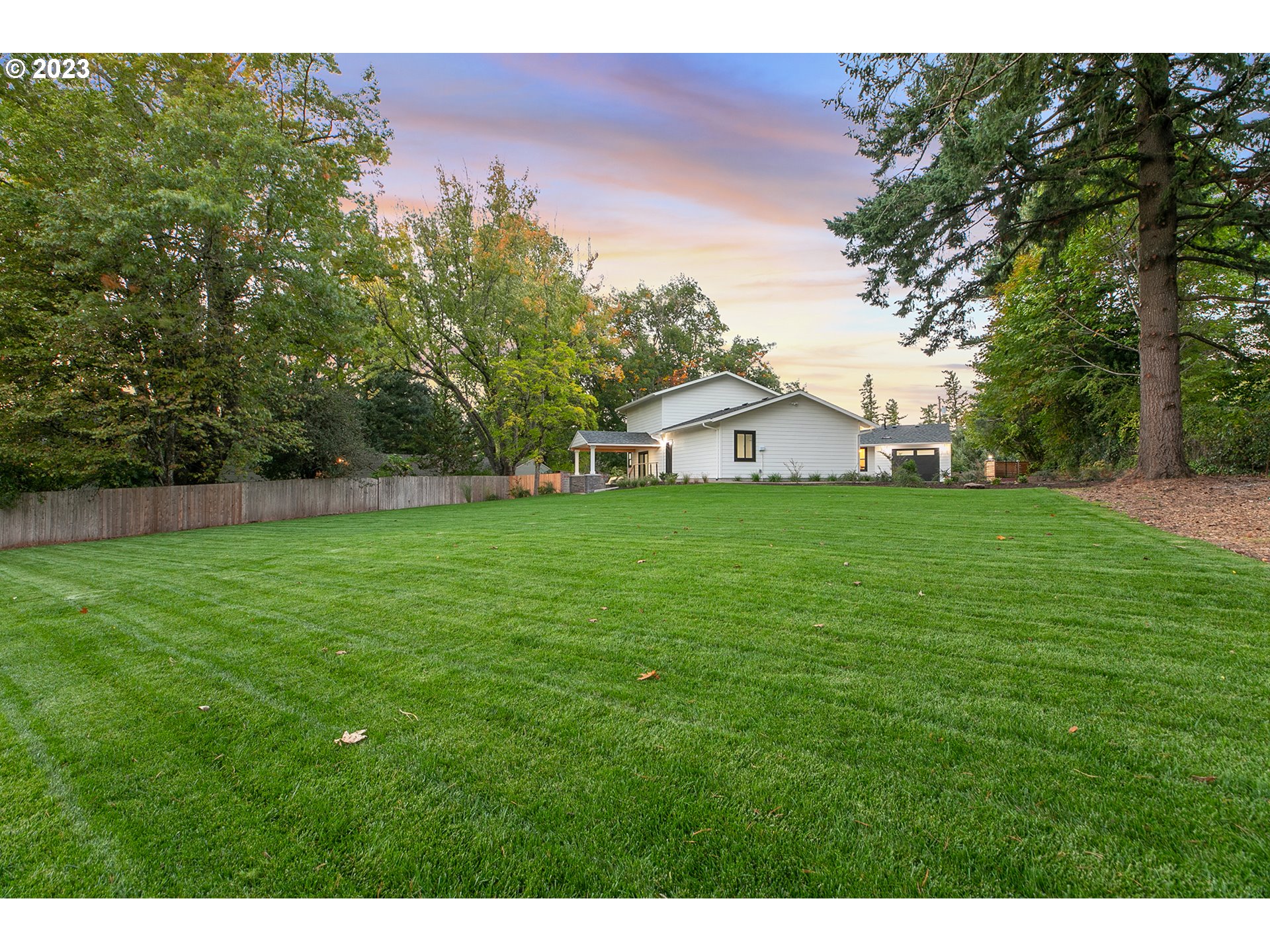 9906 Northwest Leahy Road Portland, OR 97229 - Photo 6 of 36 a view of a house with a yard