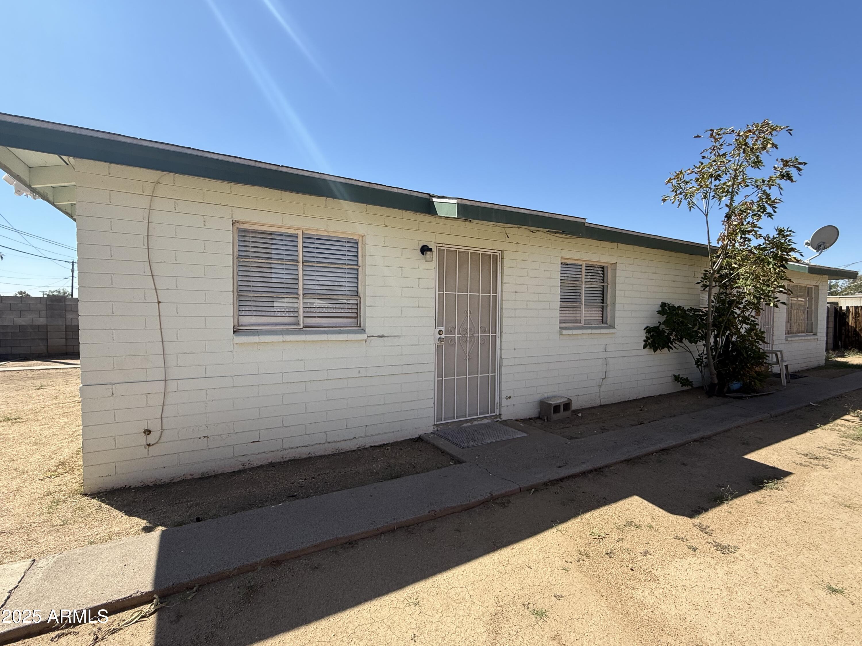 a view of house with yard