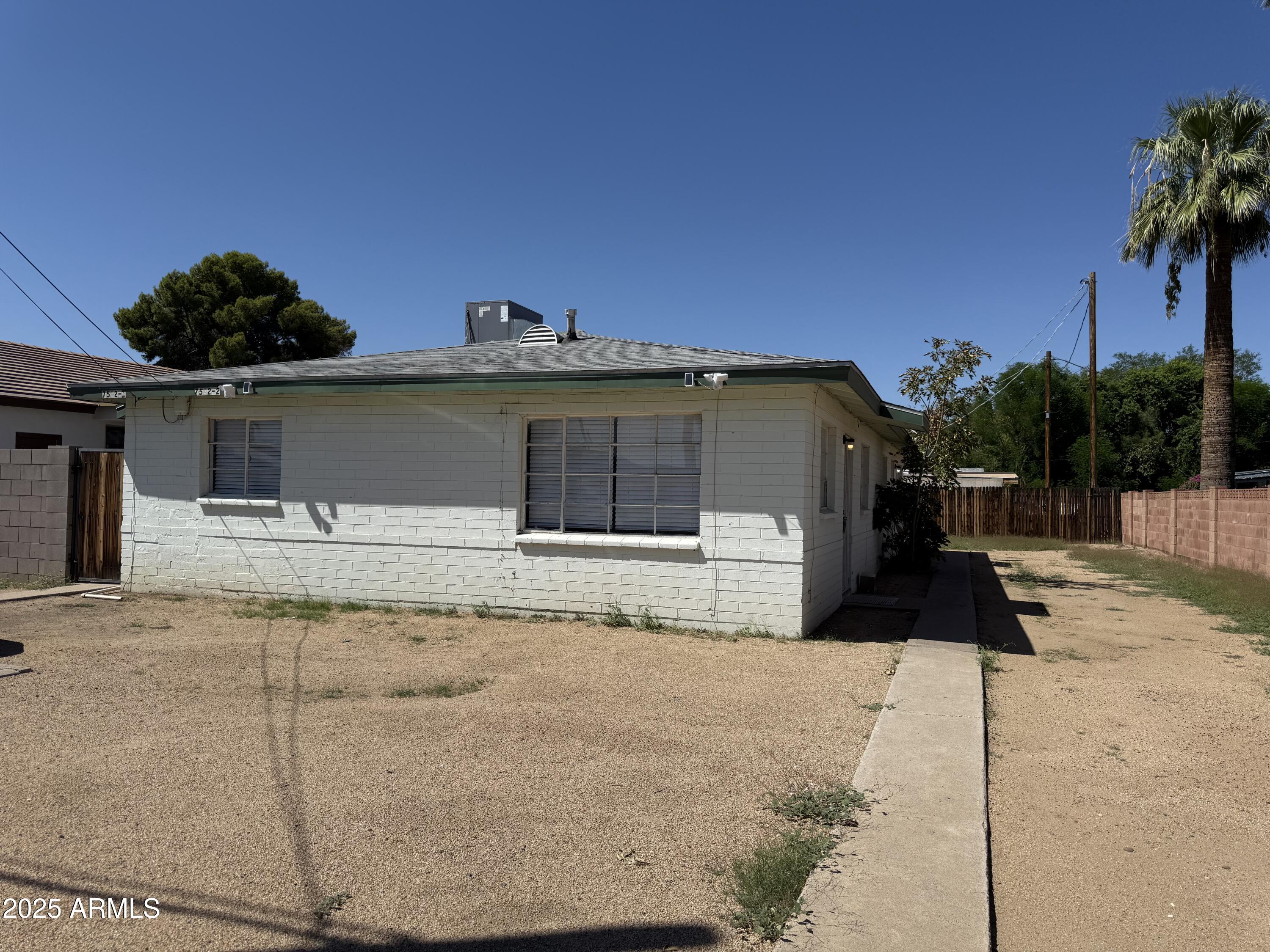 7532 North 21st Avenue, Unit 1 Phoenix, AZ 85021 - Photo 18 of 19 a front view of a house with a yard