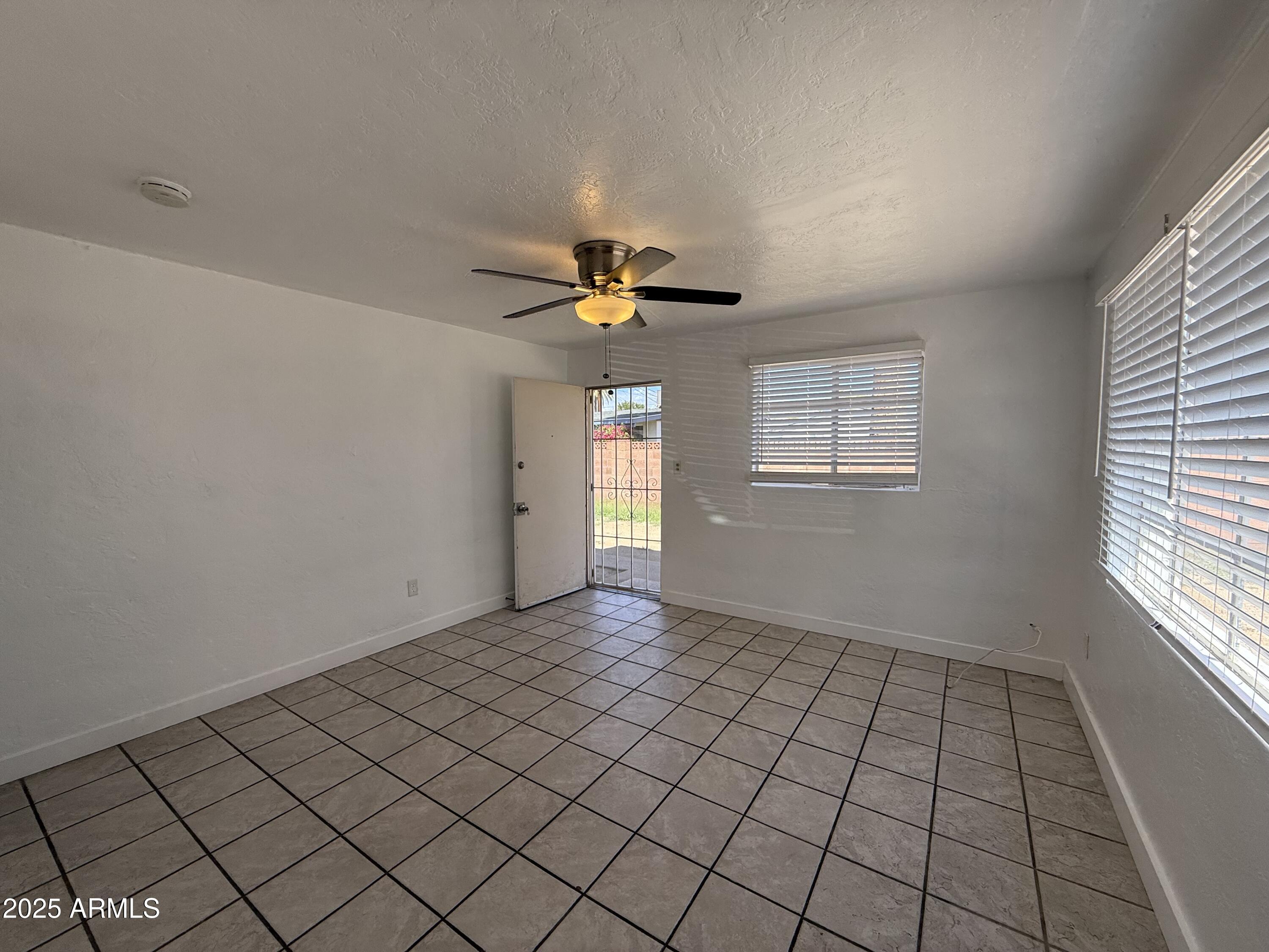 7532 North 21st Avenue, Unit 1 Phoenix, AZ 85021 - Photo 2 of 19 a view of an empty room and window