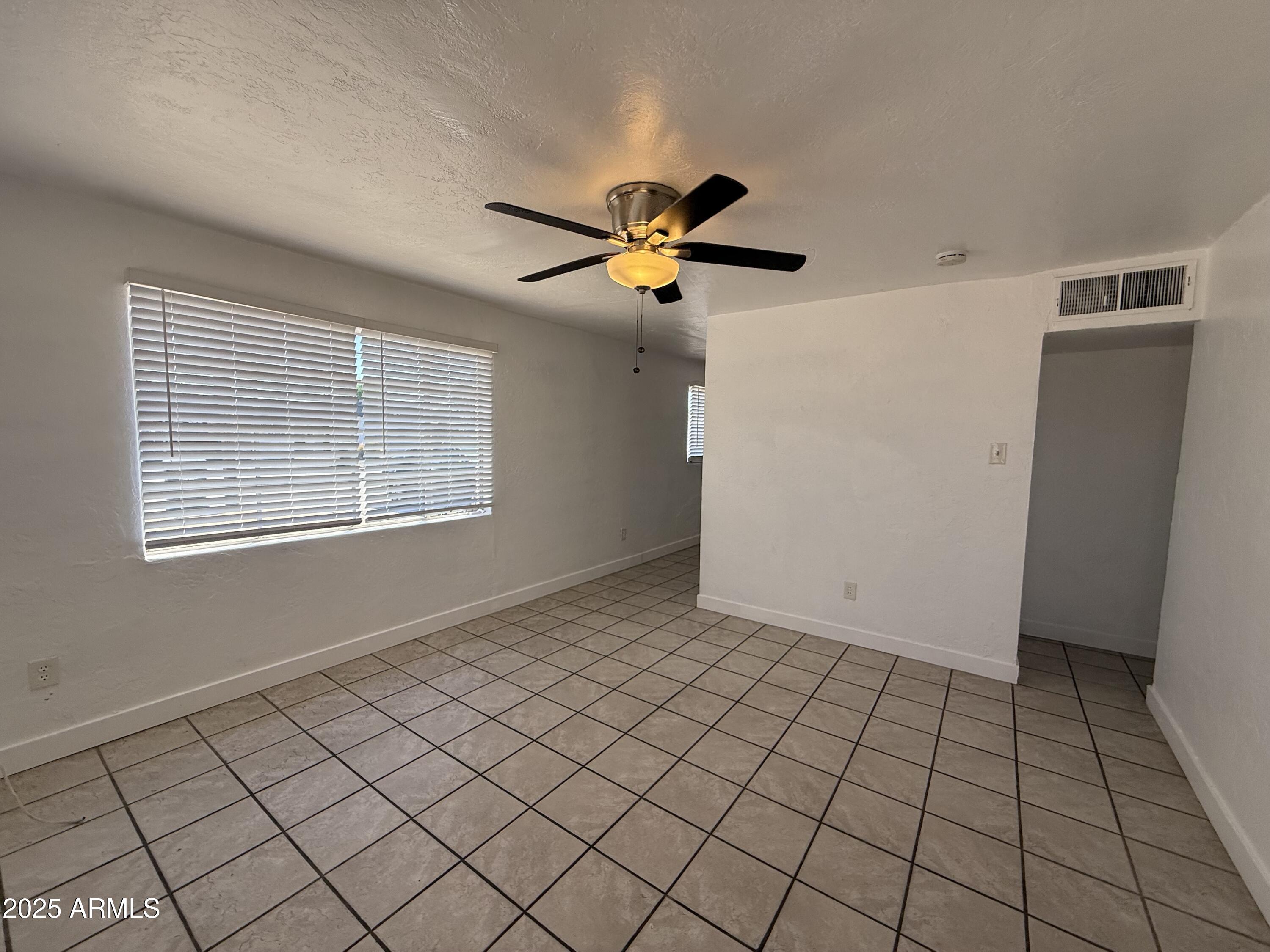 7532 North 21st Avenue, Unit 1 Phoenix, AZ 85021 - Photo 3 of 19 a view of an empty room with a window