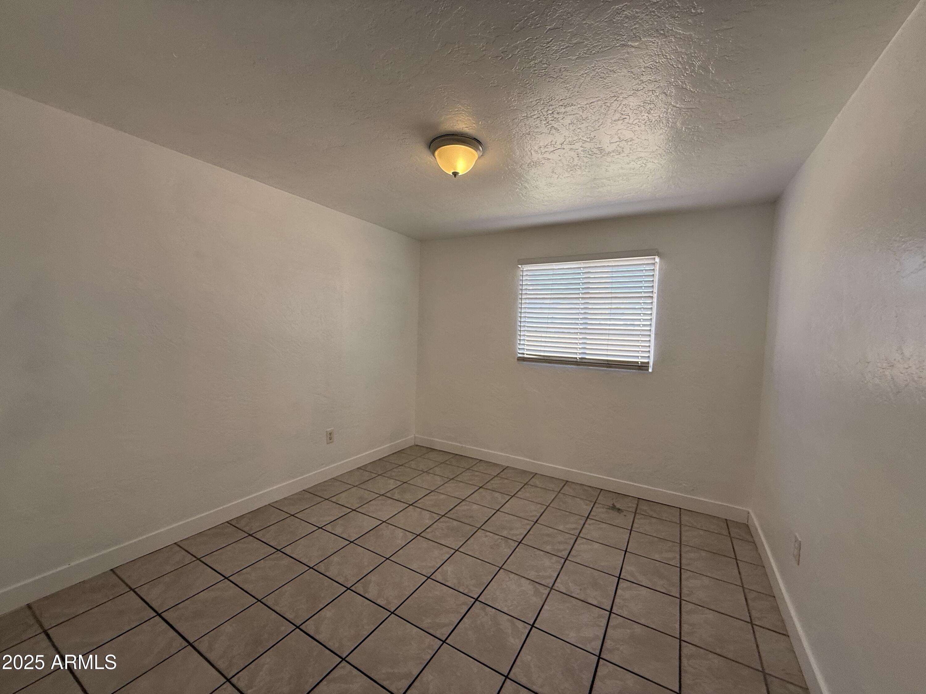 7532 North 21st Avenue, Unit 1 Phoenix, AZ 85021 - Photo 5 of 19 a view of an empty room and window
