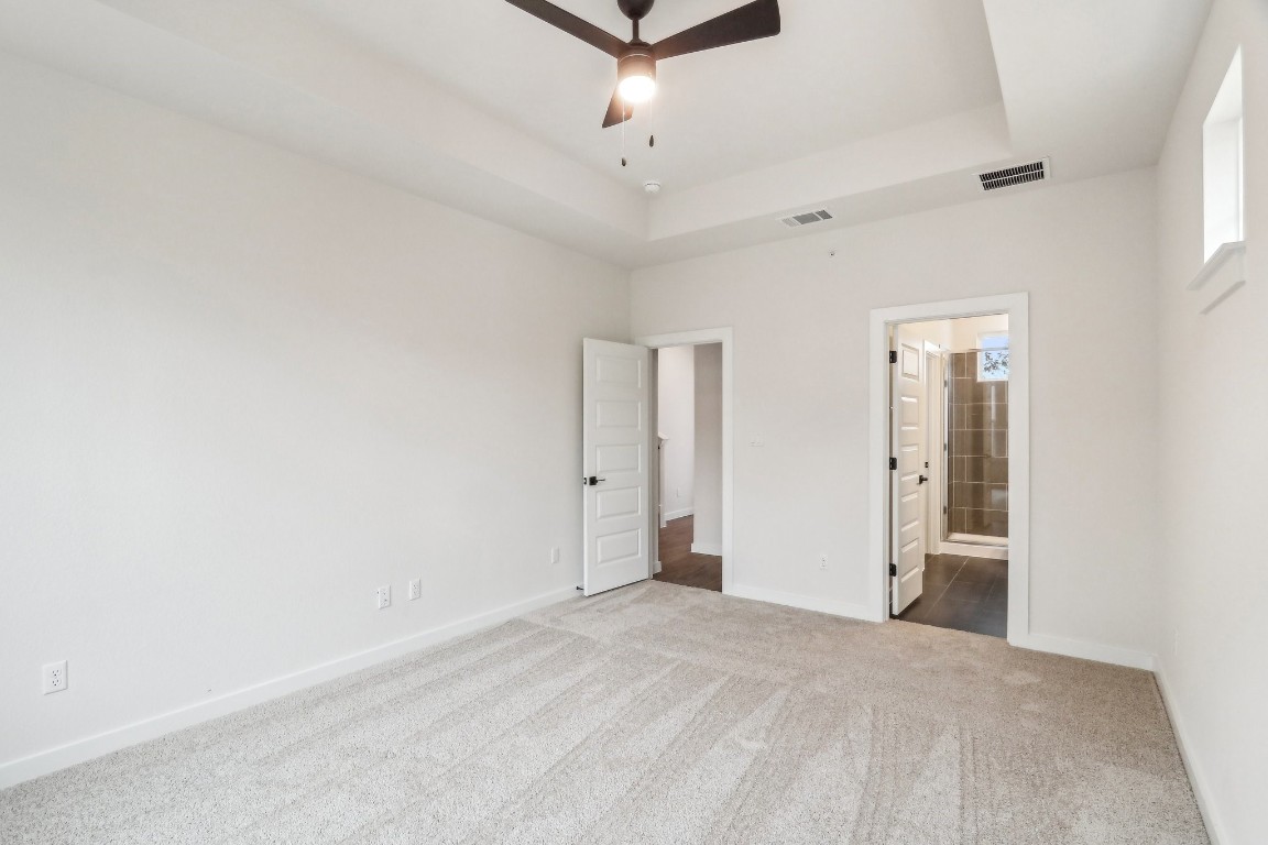 2600 Gattis School Road, Unit 1001 Round Rock, TX 78664 - Photo 18 of 36 an empty room with a ceiling fan and window
