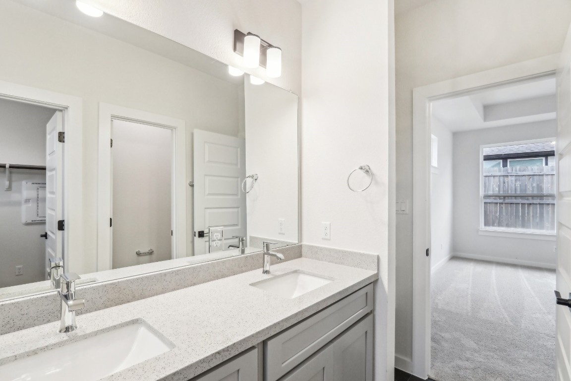 2600 Gattis School Road, Unit 1001 Round Rock, TX 78664 - Photo 20 of 36 a bathroom with a sink and a mirror