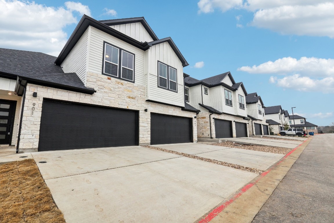 2600 Gattis School Road, Unit 1001 Round Rock, TX 78664 - Photo 3 of 36 a front view of a house with a garage