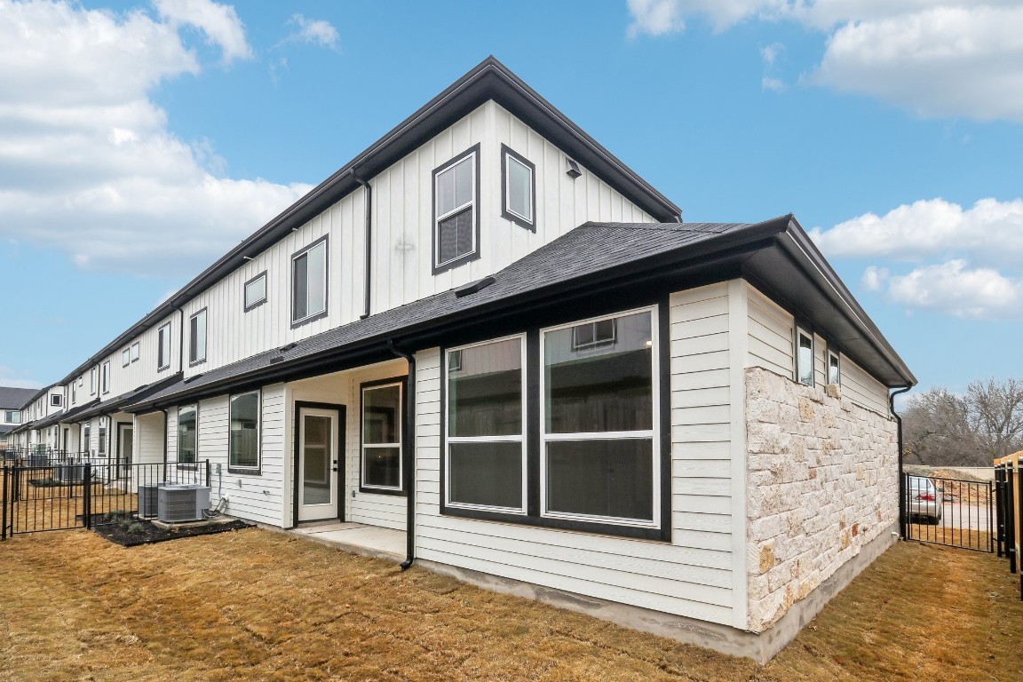 2600 Gattis School Road, Unit 1001 Round Rock, TX 78664 - Photo 34 of 36 a front view of a house with a yard and garage