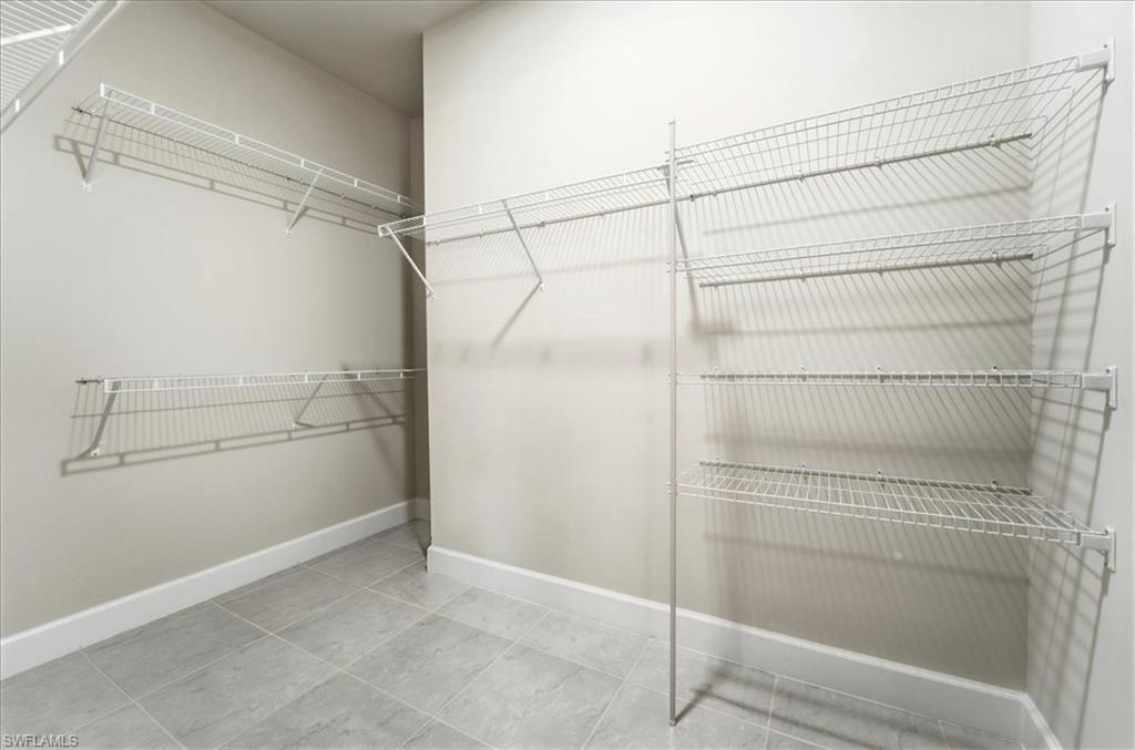 5935 Mayflower Way Ave Maria, FL 34142 - Photo 11 of 36 a view of a room with racks on the wall