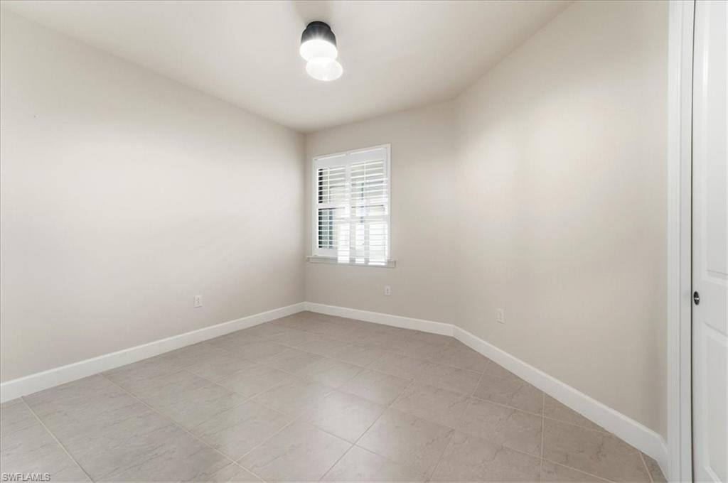 5935 Mayflower Way Ave Maria, FL 34142 - Photo 13 of 36 an empty room with a window