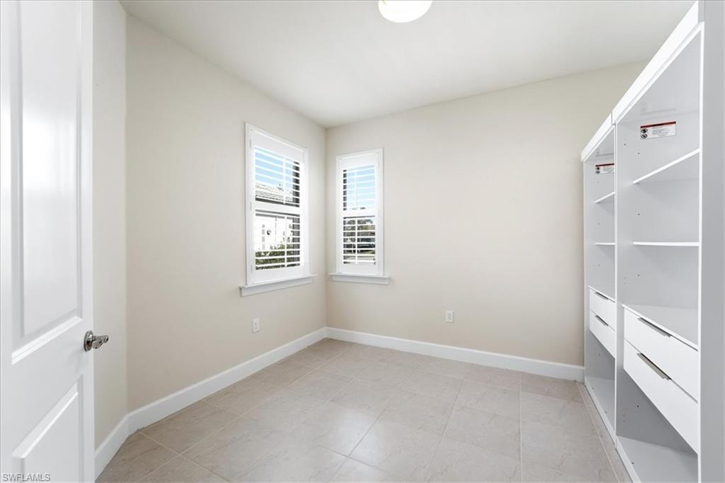 5935 Mayflower Way Ave Maria, FL 34142 - Photo 17 of 36 a view of an empty room with a window