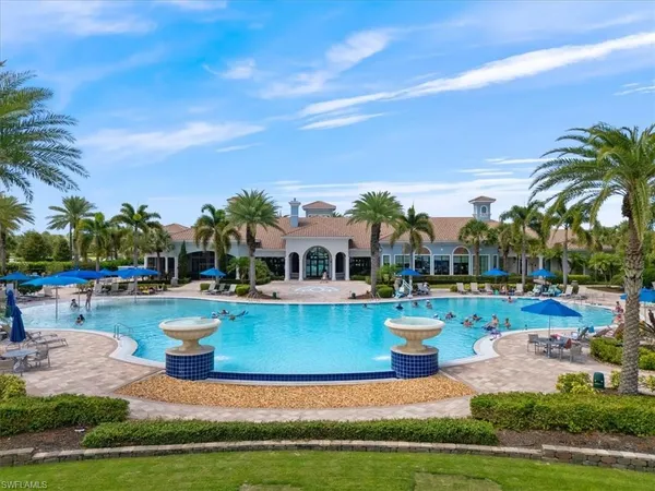 a view of a house with swimming pool and a garden