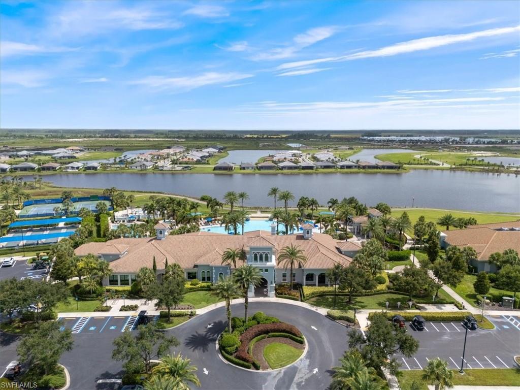 5935 Mayflower Way Ave Maria, FL 34142 - Photo 26 of 36 a view of a lake with a city