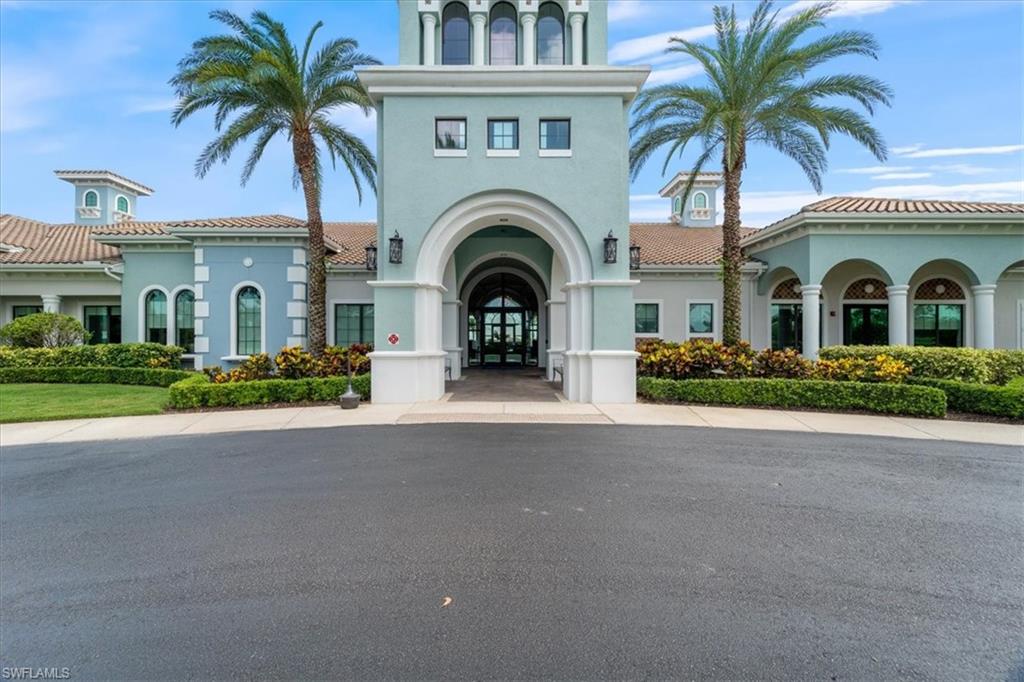 5935 Mayflower Way Ave Maria, FL 34142 - Photo 28 of 36 a front view of a house with a garden