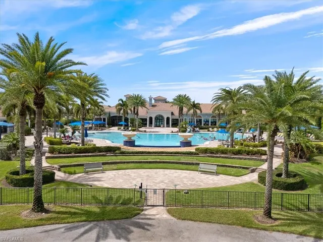 a view of swimming pool and trees in the background