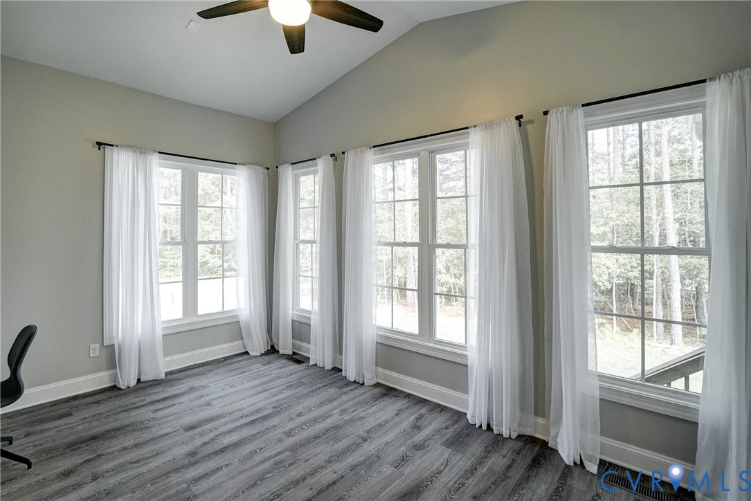 4669 Woburn Road Providence Forge, VA 23140 - Photo 33 of 78 a view of an empty room with wooden floor and a window