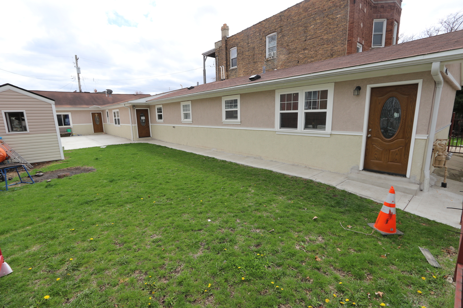 a front view of a house with garden