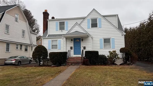 a view of a house with a yard and a large window
