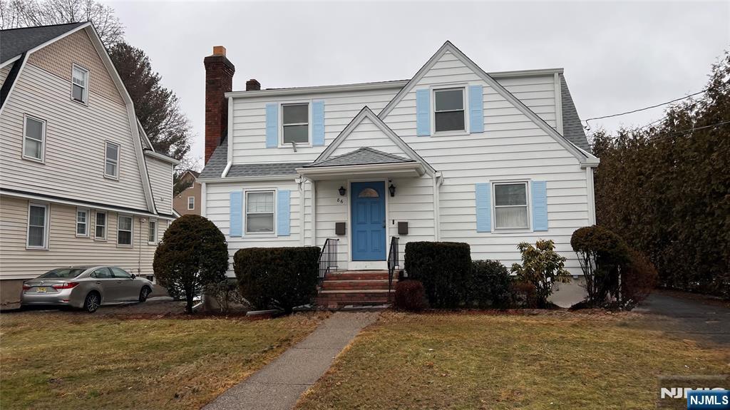 86 North Walnut Street Ridgewood, NJ 07450 - Photo 1 of 17 a view of a house with a yard and a large window