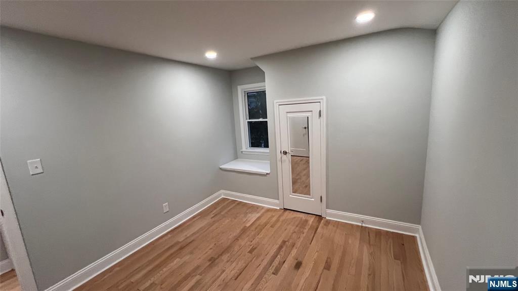 86 North Walnut Street Ridgewood, NJ 07450 - Photo 13 of 17 an empty room with wooden floor and mirror