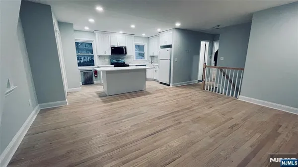 a view of kitchen with wooden floor