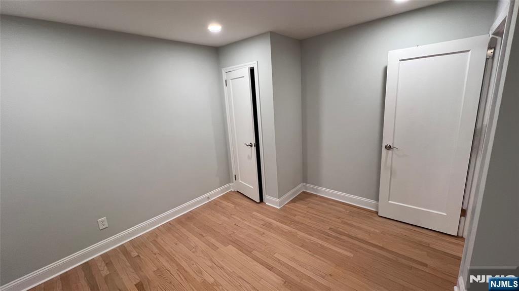 86 North Walnut Street Ridgewood, NJ 07450 - Photo 10 of 17 an empty room with wooden floor and sliding door