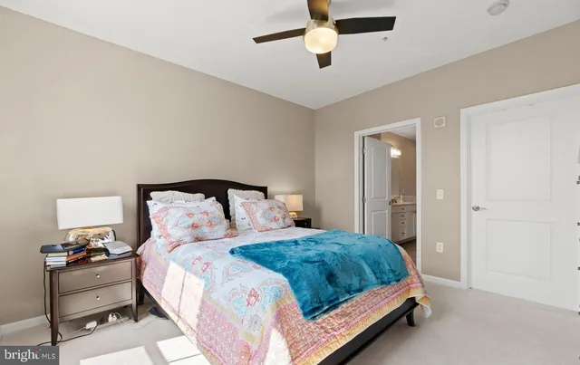 a bedroom with a bed and a lamp