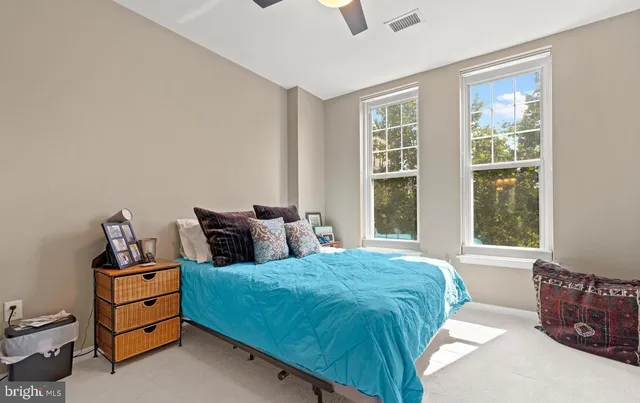 a bedroom with bed and window