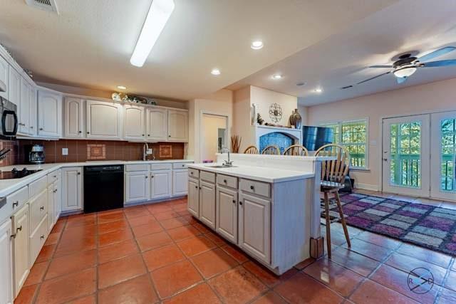 6209 Point La Vista Road Malakoff, TX 75148 - Photo 7 of 38 a kitchen with a sink window and cabinets