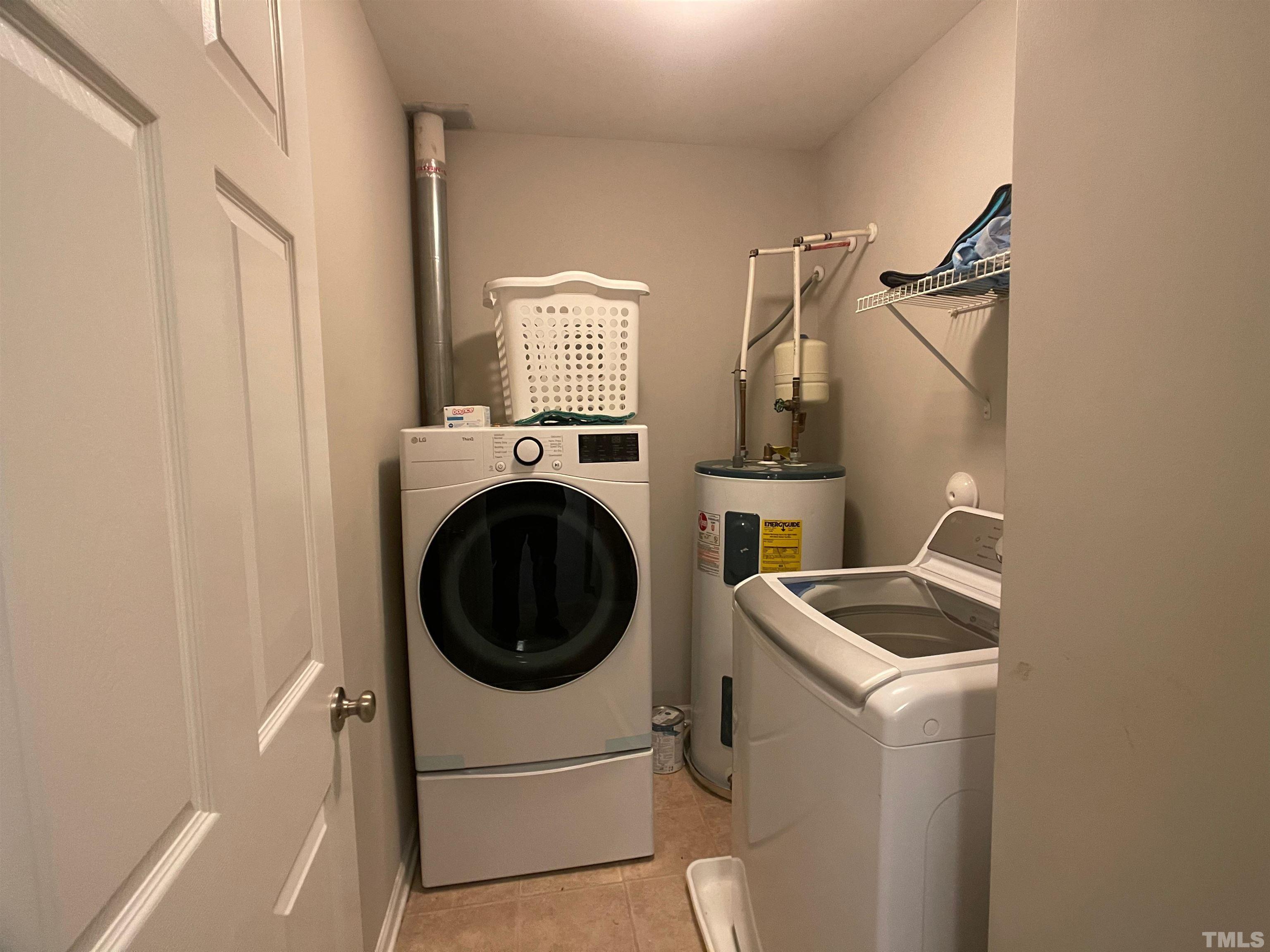 11710 Mezzanine Drive, Unit 101 Raleigh, NC 27614 - Photo 13 of 23 a utility room with dryer and washer