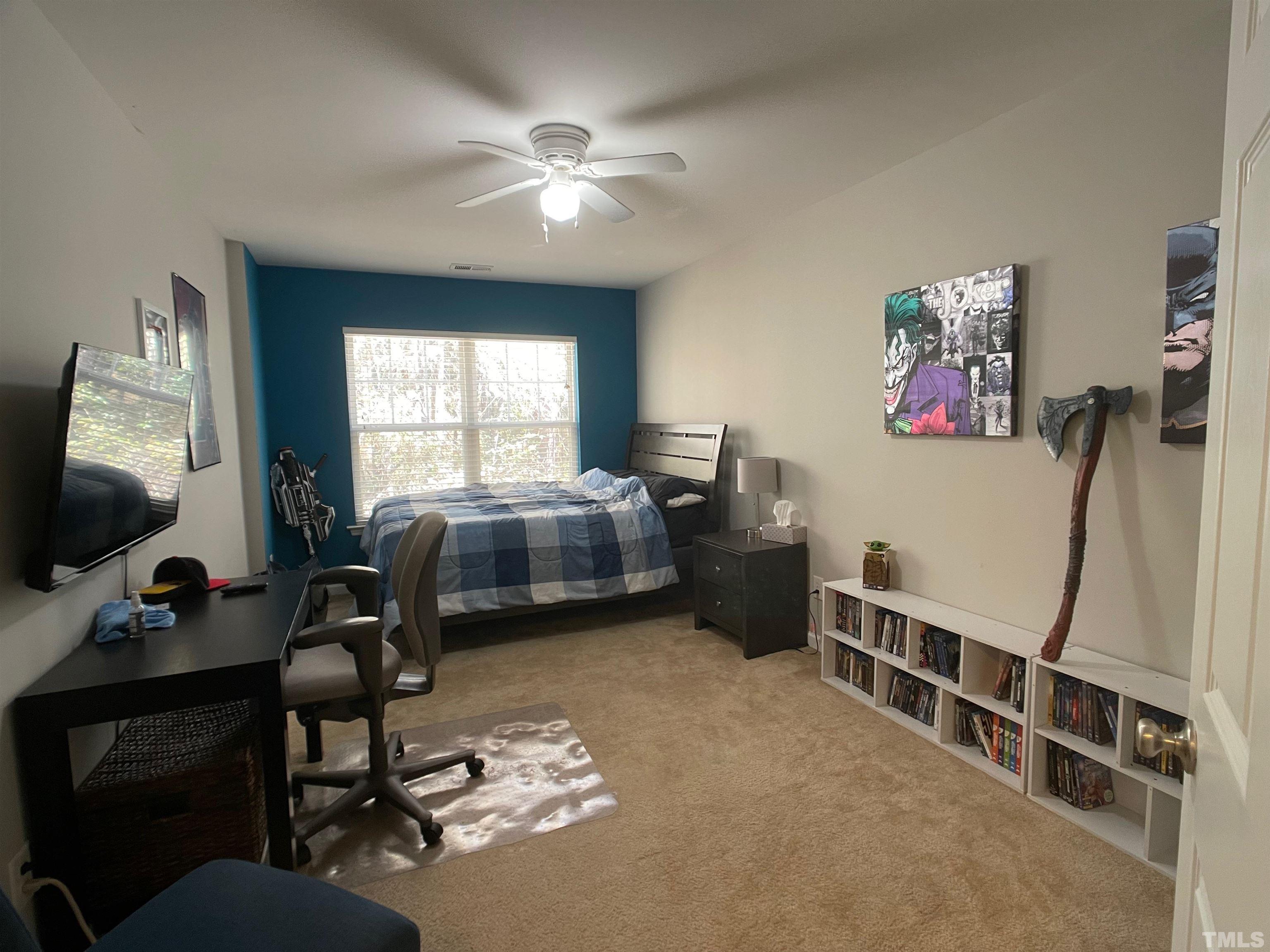 11710 Mezzanine Drive, Unit 101 Raleigh, NC 27614 - Photo 14 of 23 a bedroom with furniture and a window