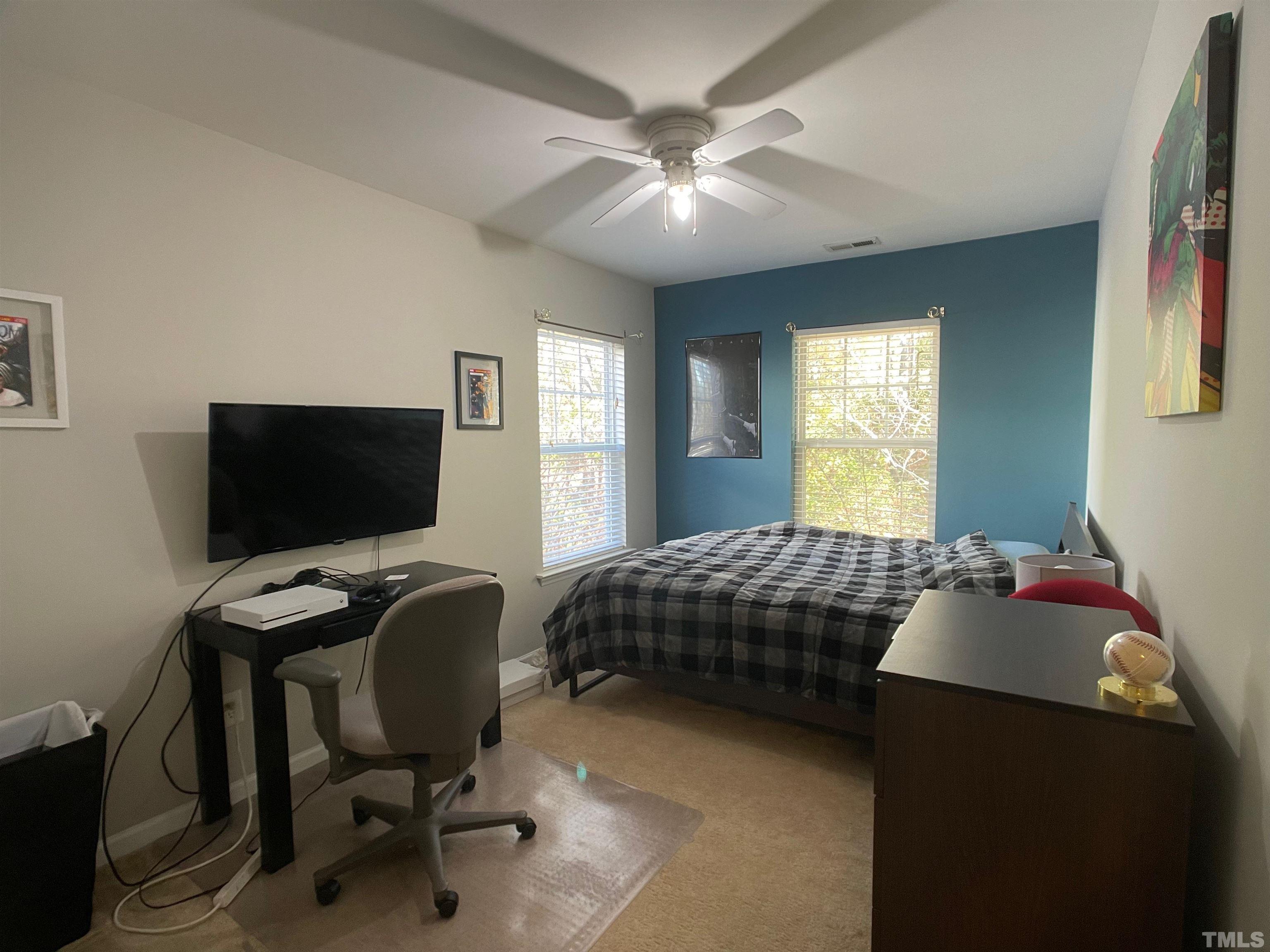 11710 Mezzanine Drive, Unit 101 Raleigh, NC 27614 - Photo 15 of 23 a bedroom with a bed and a window
