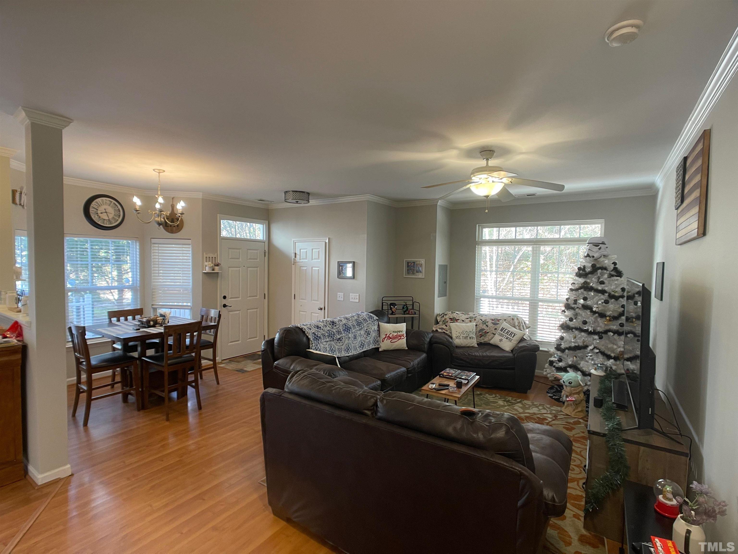 11710 Mezzanine Drive, Unit 101 Raleigh, NC 27614 - Photo 2 of 23 a living room with furniture window and wooden floor