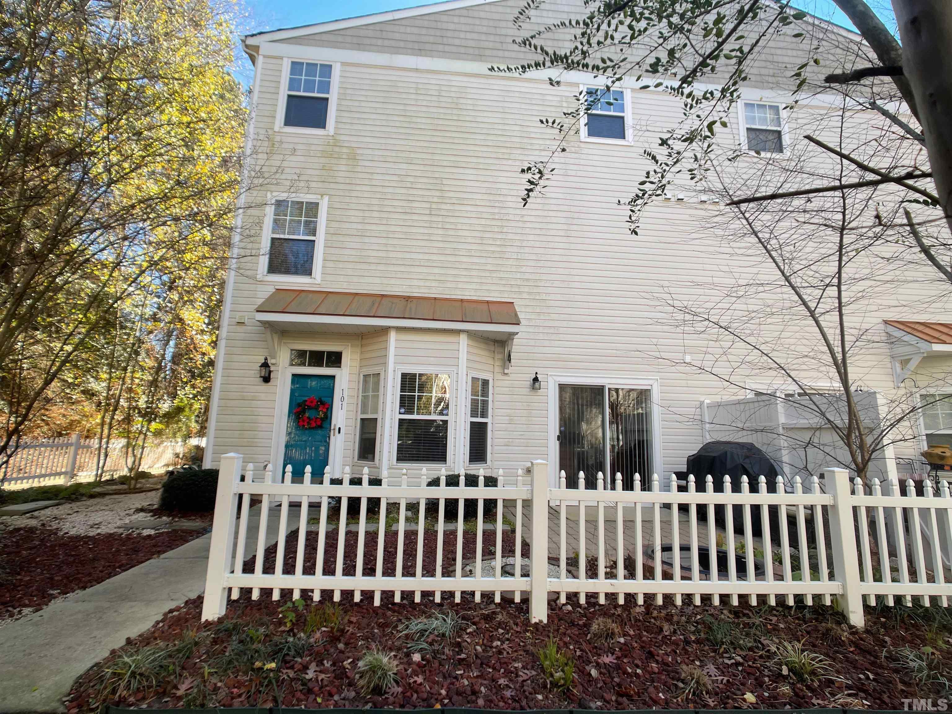 11710 Mezzanine Drive, Unit 101 Raleigh, NC 27614 - Photo 21 of 23 a front view of a house with a garden