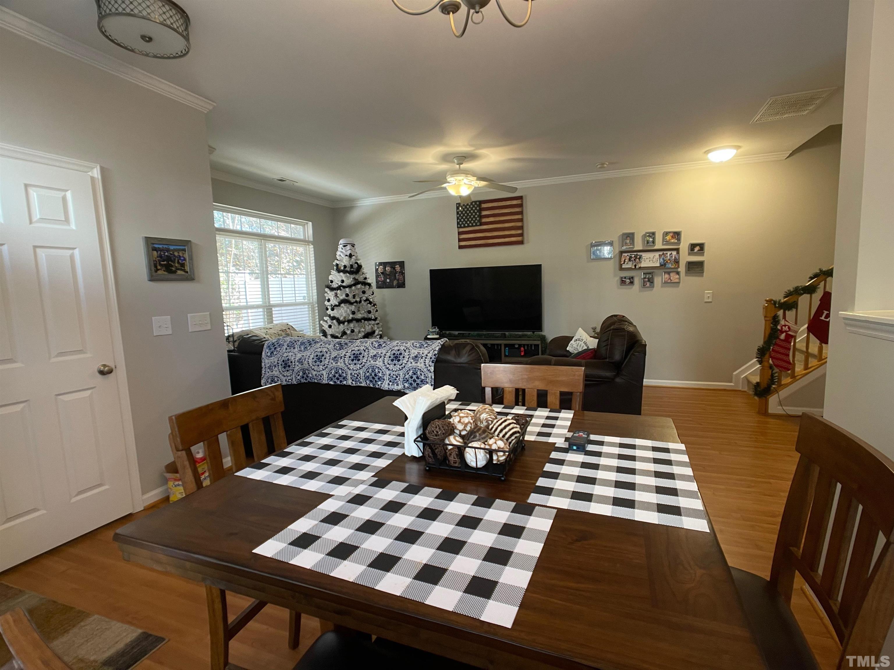 11710 Mezzanine Drive, Unit 101 Raleigh, NC 27614 - Photo 5 of 23 a living room with furniture a rug and a flat screen tv