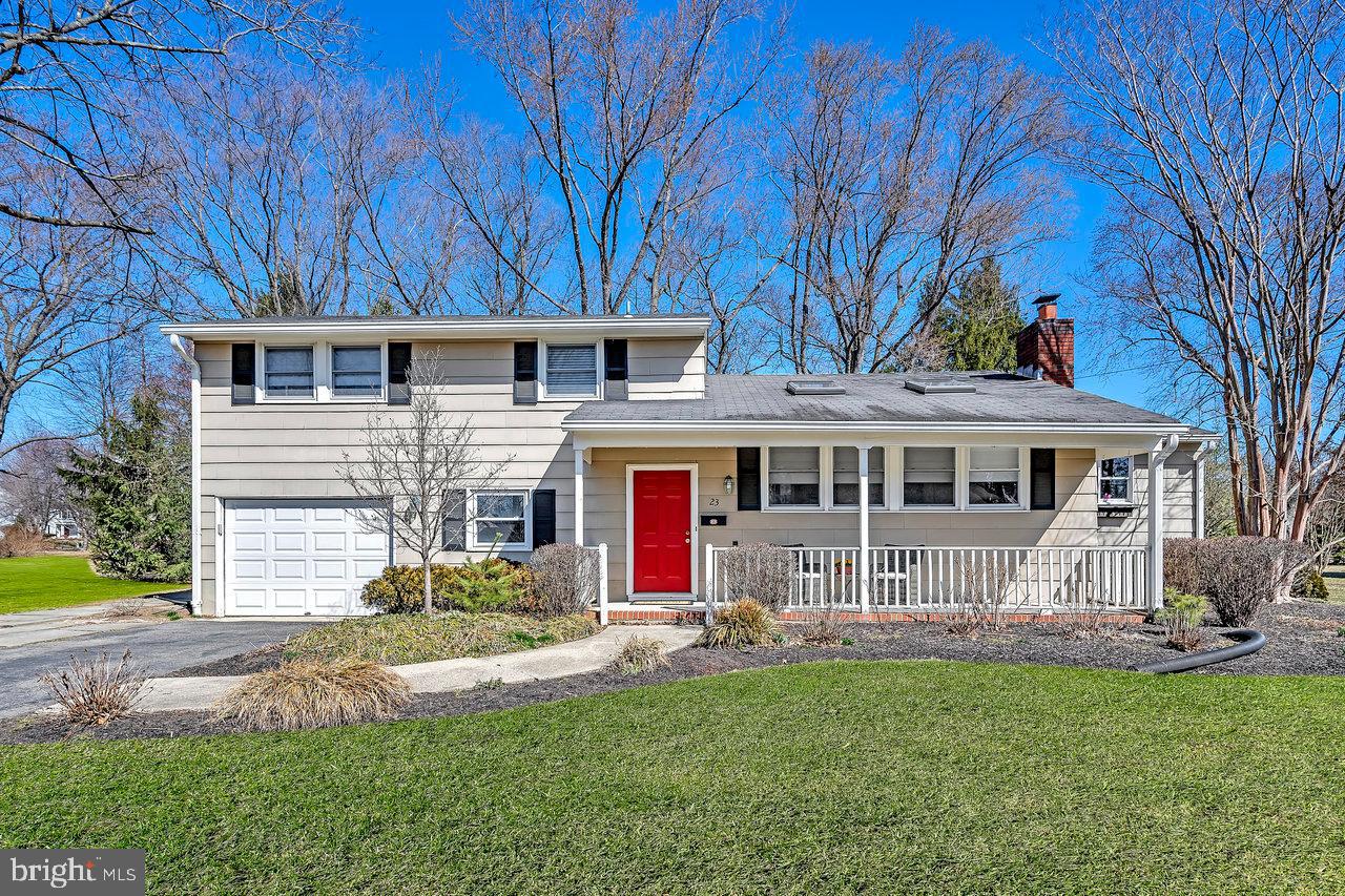 23 Griggs Road Cranbury, NJ 08512 - Photo 1 of 40 a front view of a house with a yard