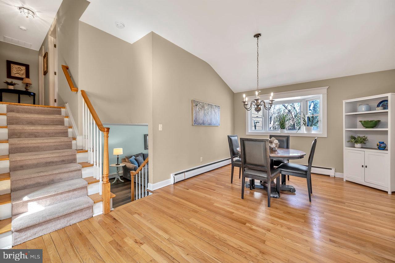 23 Griggs Road Cranbury, NJ 08512 - Photo 12 of 40 a view of a dining room with furniture window and wooden floor
