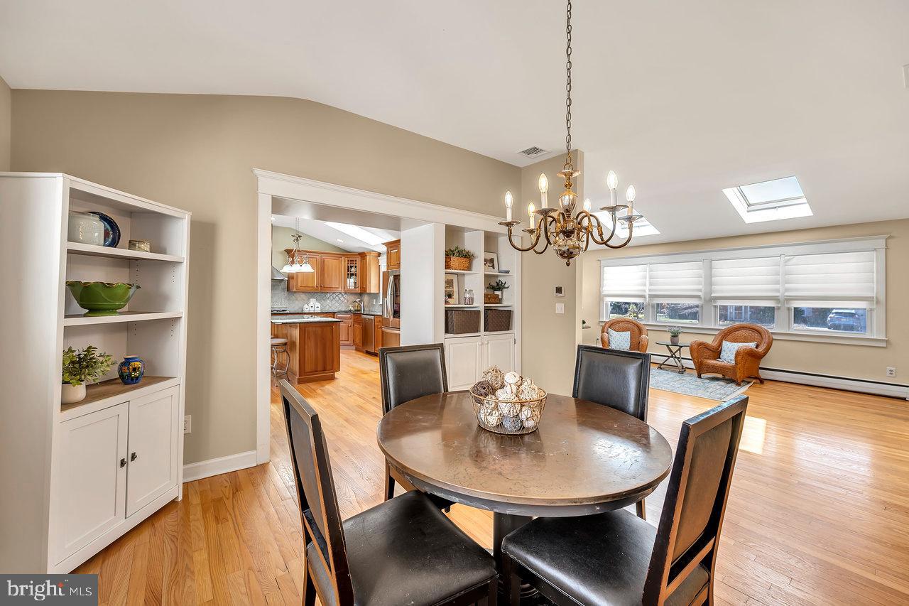 23 Griggs Road Cranbury, NJ 08512 - Photo 14 of 40 a view of a dining room with furniture window and wooden floor
