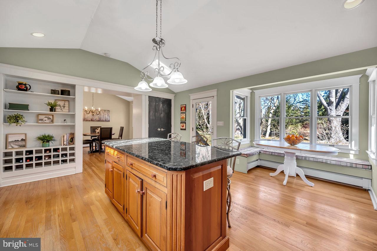 23 Griggs Road Cranbury, NJ 08512 - Photo 19 of 40 a kitchen with stainless steel appliances granite countertop a stove and a wooden floors