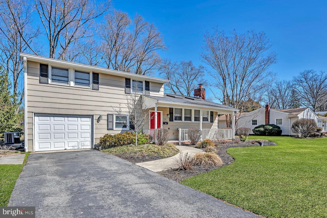 23 Griggs Road Cranbury, NJ 08512 - Photo 2 of 40 a view of house with a yard