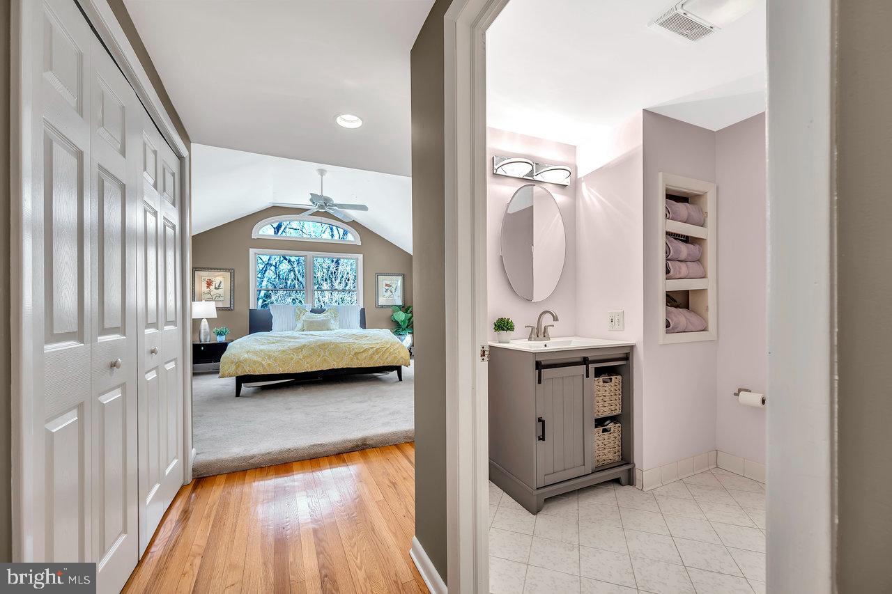 23 Griggs Road Cranbury, NJ 08512 - Photo 25 of 40 a en suite bathroom with a sink and a mirror