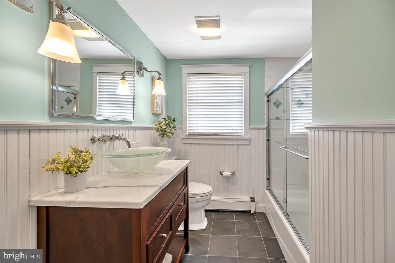 23 Griggs Road Cranbury, NJ 08512 - Photo 29 of 40 a bathroom with a sink a toilet and a window