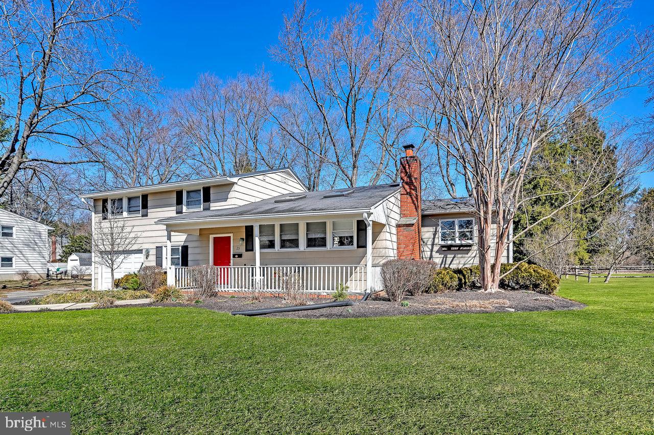 23 Griggs Road Cranbury, NJ 08512 - Photo 3 of 40 a front view of a house with garden