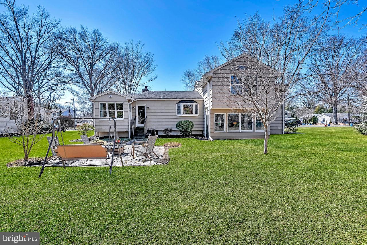 23 Griggs Road Cranbury, NJ 08512 - Photo 37 of 40 a view of a house with a back yard