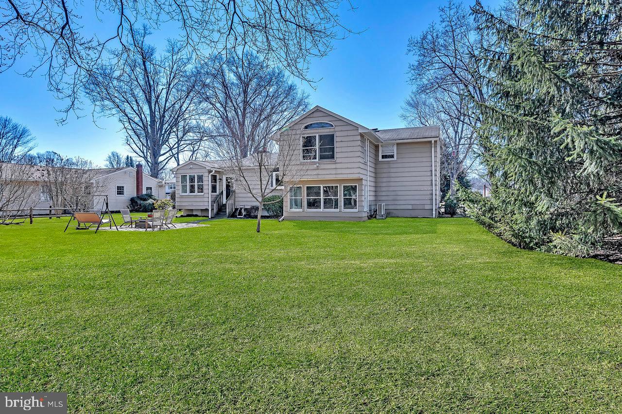 23 Griggs Road Cranbury, NJ 08512 - Photo 39 of 40 a view of a house with a yard and sitting area