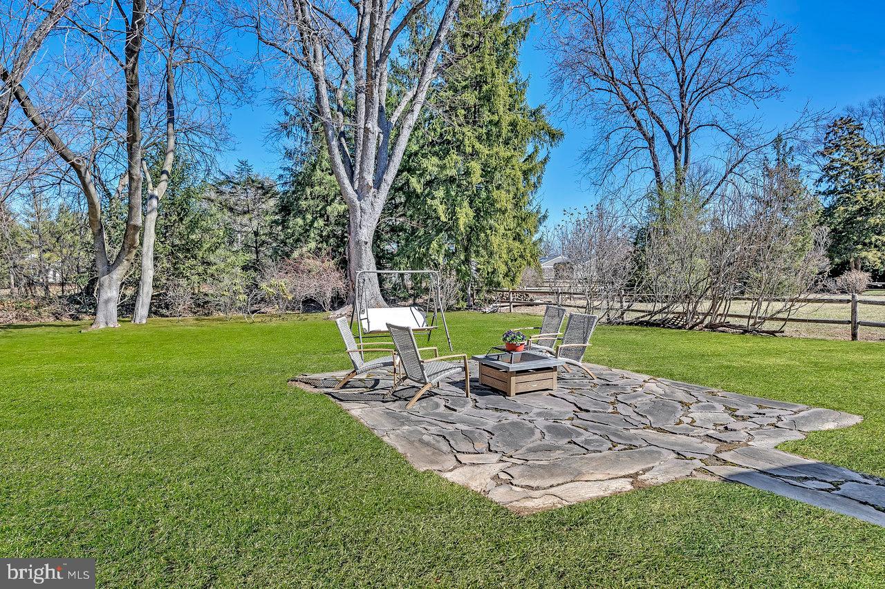 23 Griggs Road Cranbury, NJ 08512 - Photo 40 of 40 a view of a chair and table on the garden