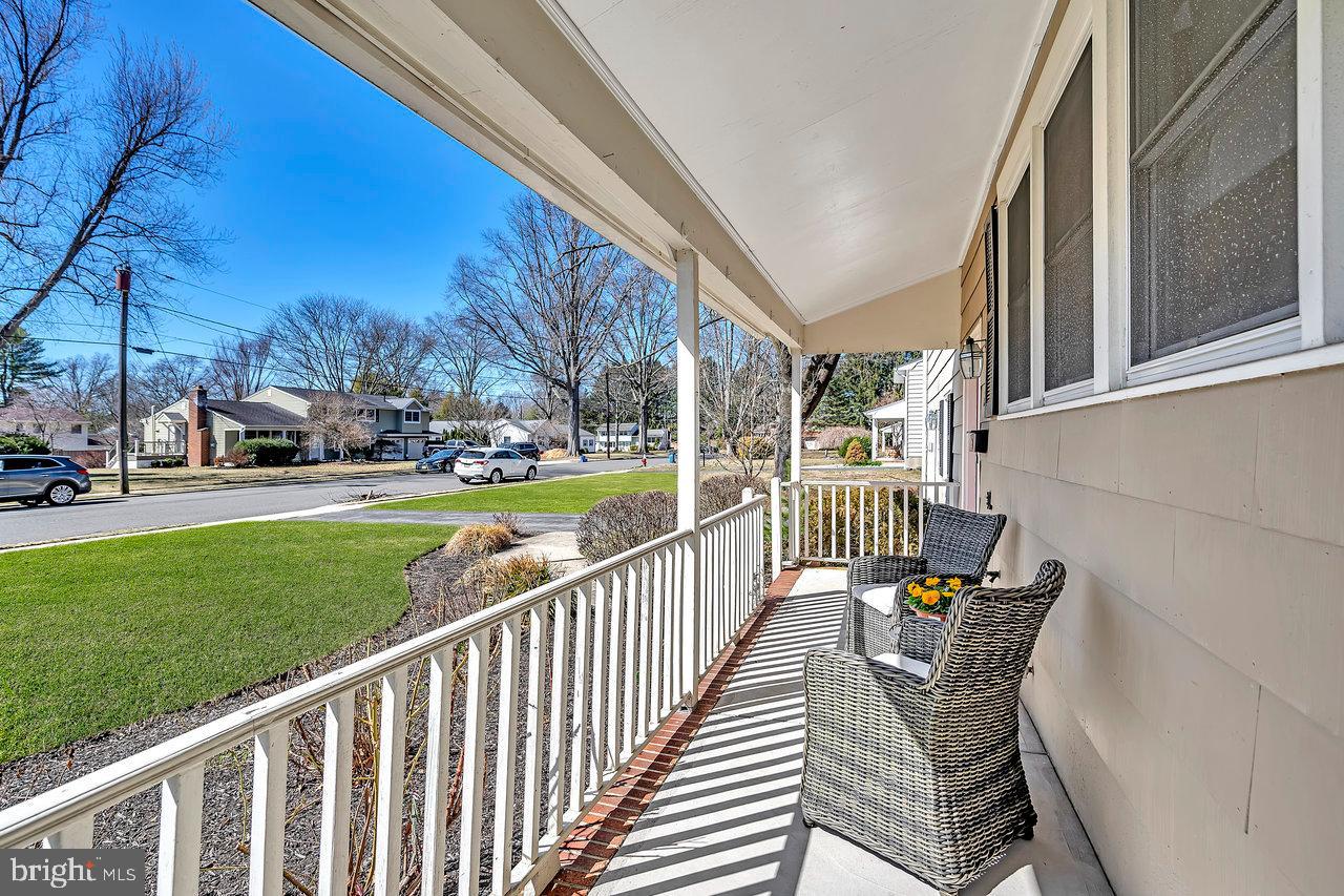 23 Griggs Road Cranbury, NJ 08512 - Photo 4 of 40 a view of a chair and trees in the garden