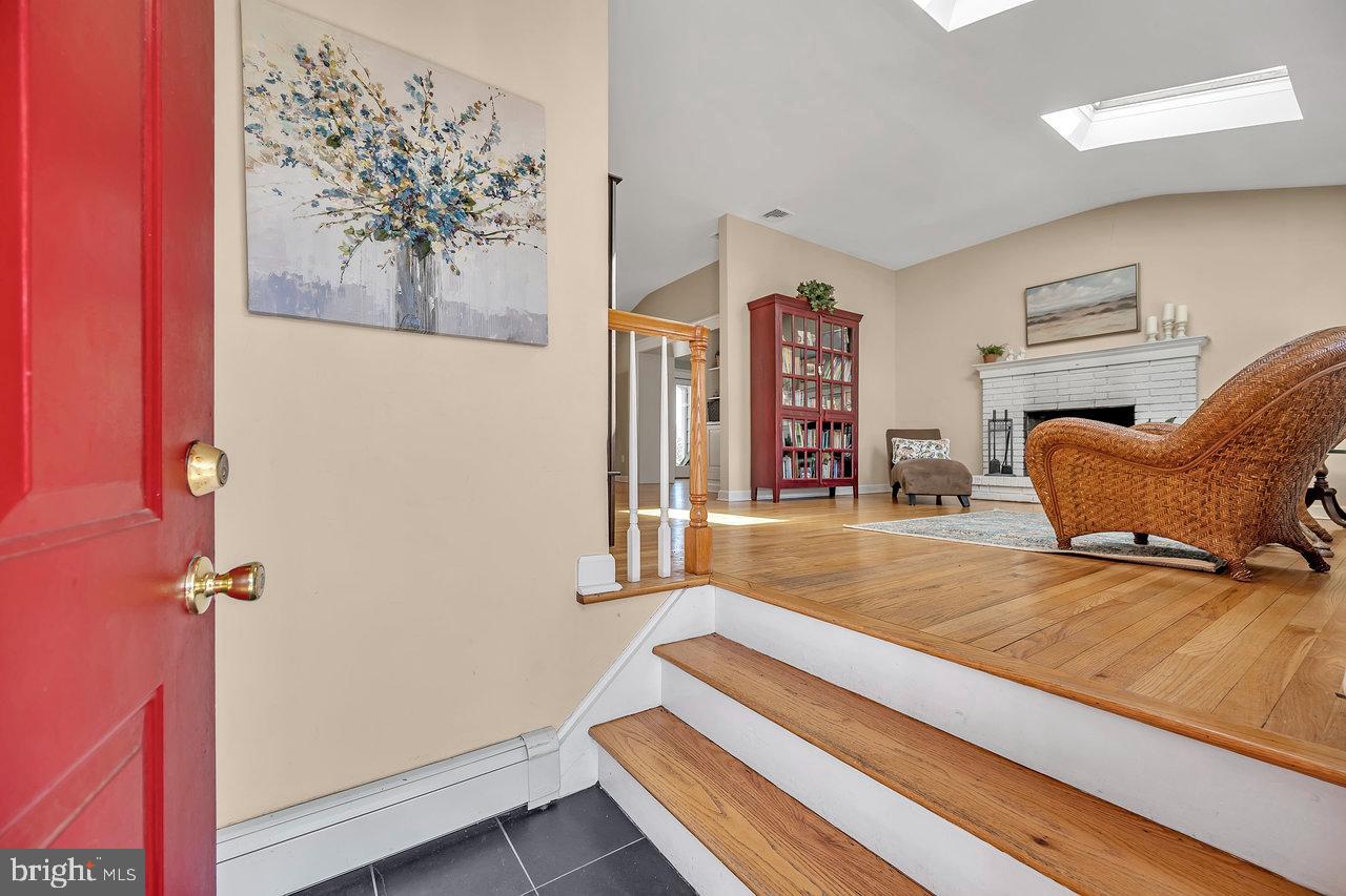 23 Griggs Road Cranbury, NJ 08512 - Photo 6 of 40 a bedroom with furniture and a wooden floor